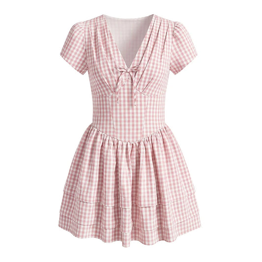 Pink and white checkered dress on a white background