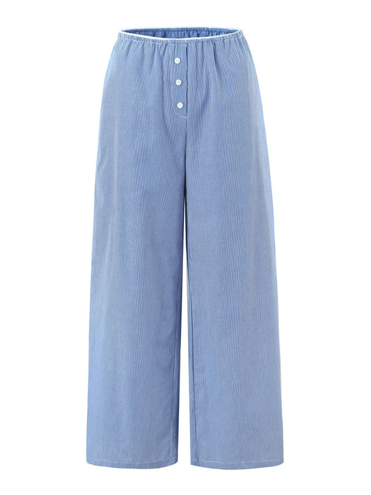 Light blue wide-leg pants with button details on a white background