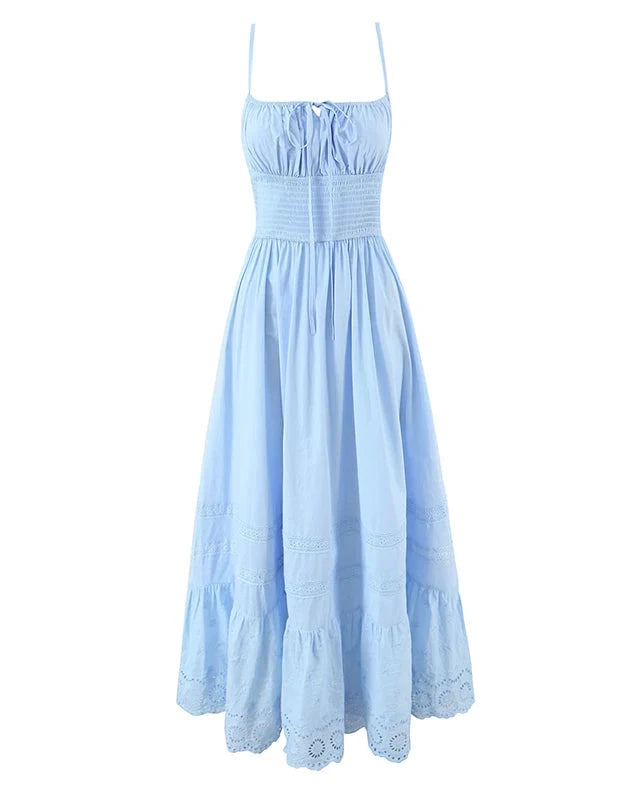 Light blue dress with thin straps on a white background