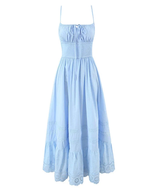 Light blue dress with thin straps on a white background